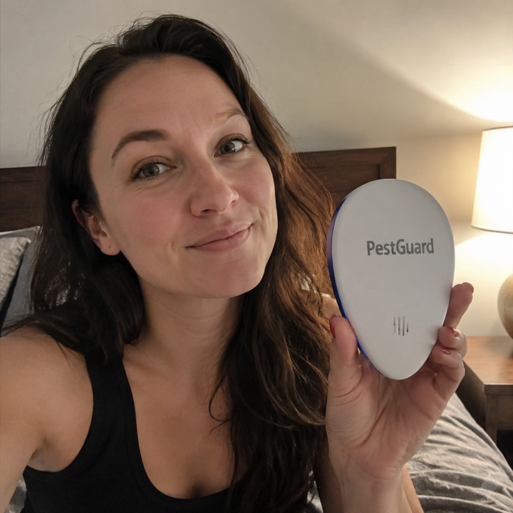 Tracy holding PestGuard in her bedroom